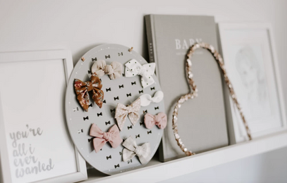 Grey Bow Plaque on shelf